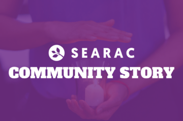 SEARAC Community Story: Image of hand over a candle