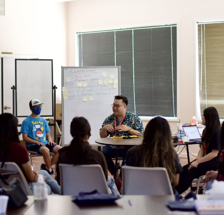 person speaks to a classroom of youth