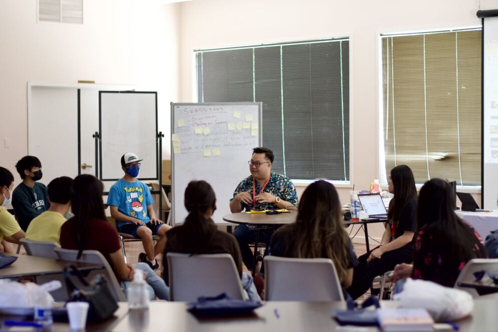 person speaks to a classroom of youth