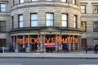 Activists holding signs in solidarity with the Black Lives Matter movement.