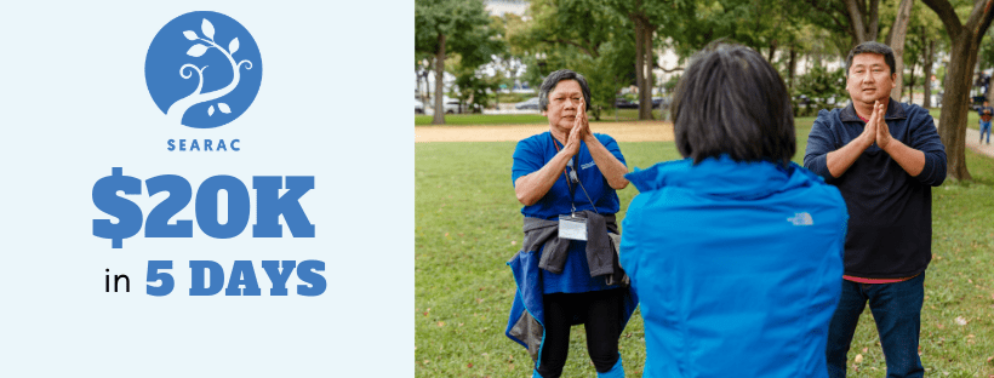 An end of year fundraising campaign header with people praying together