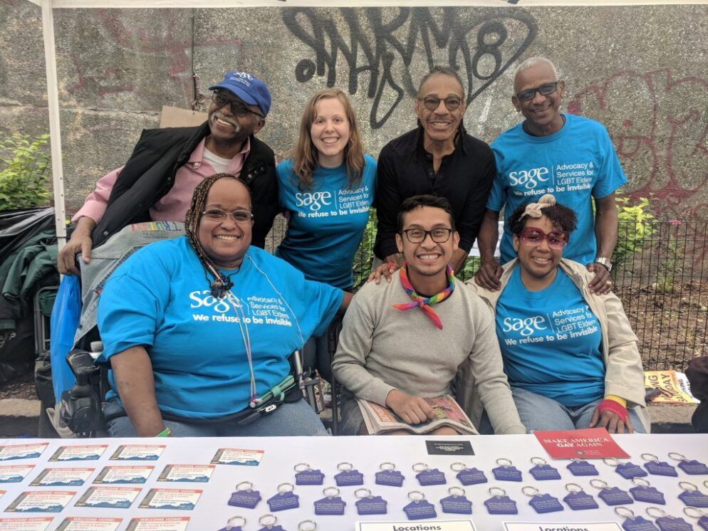 SEARAC staff member Jenna McDavid (back row, second from left) tabling with SAGE staff and volunteers at Harlem Pride in 2018.