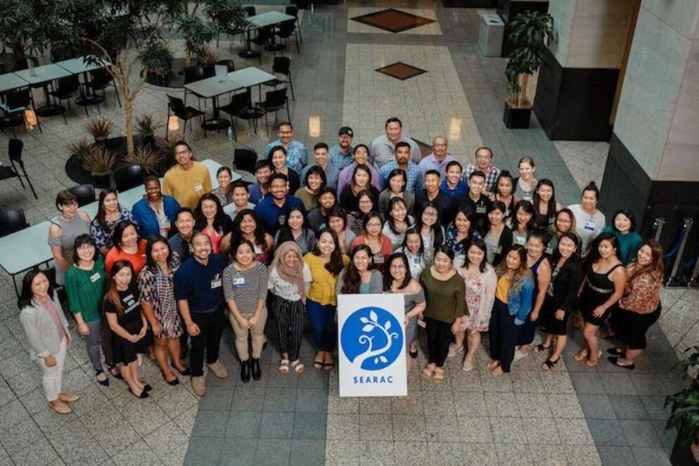 A group of people pose together.