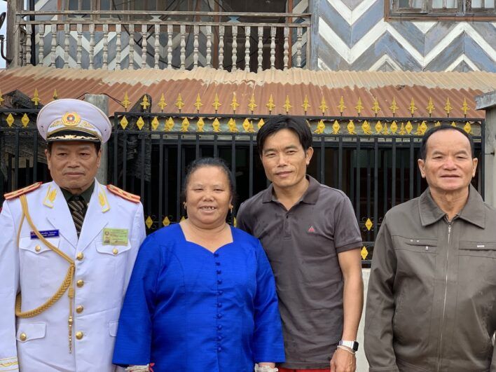 Four people smiling together