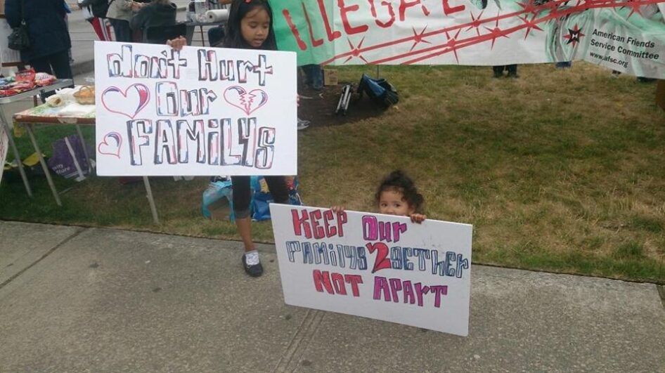 Two children holding up a sign. 