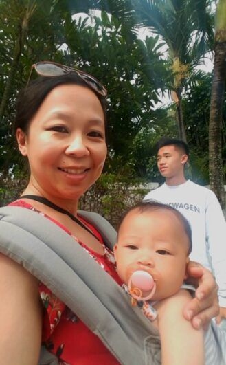 May taking a selfie with a baby.