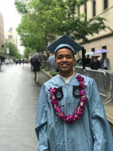 Ocean smiling in his Cornell gown.