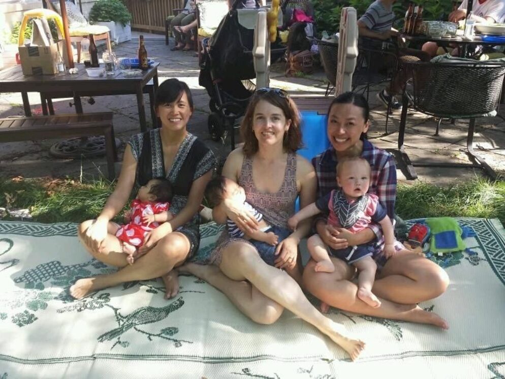 3 people holding babies