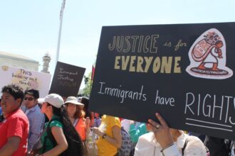 Someone holding a sign