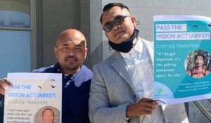 Two people at anti-deportation rally