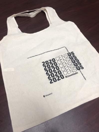 A tote bag that has 2020 Census repeated over.