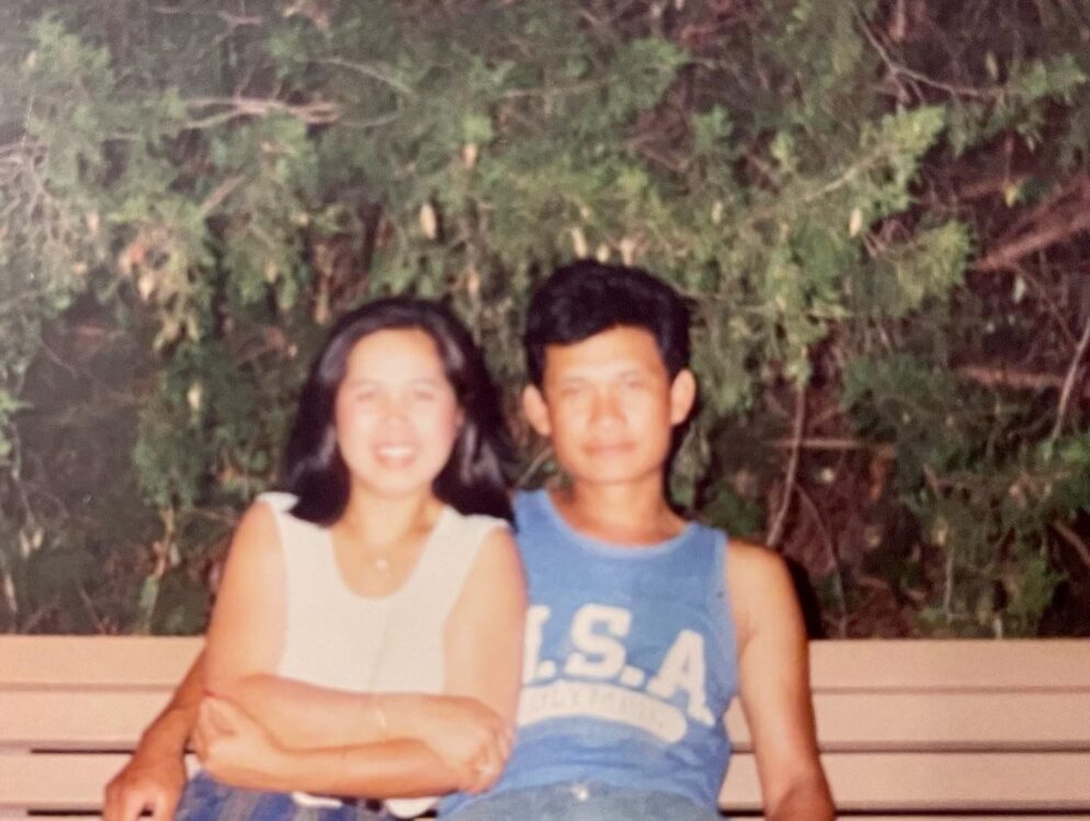 A couple sitting on the bench.