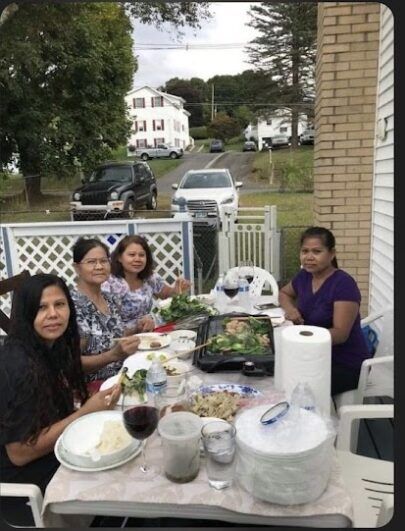 Women at a table eating.