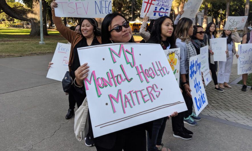 Advocates holding signs for mental health