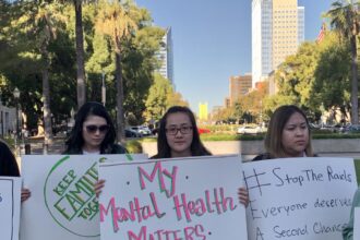 Advocates holding signs to support mental health