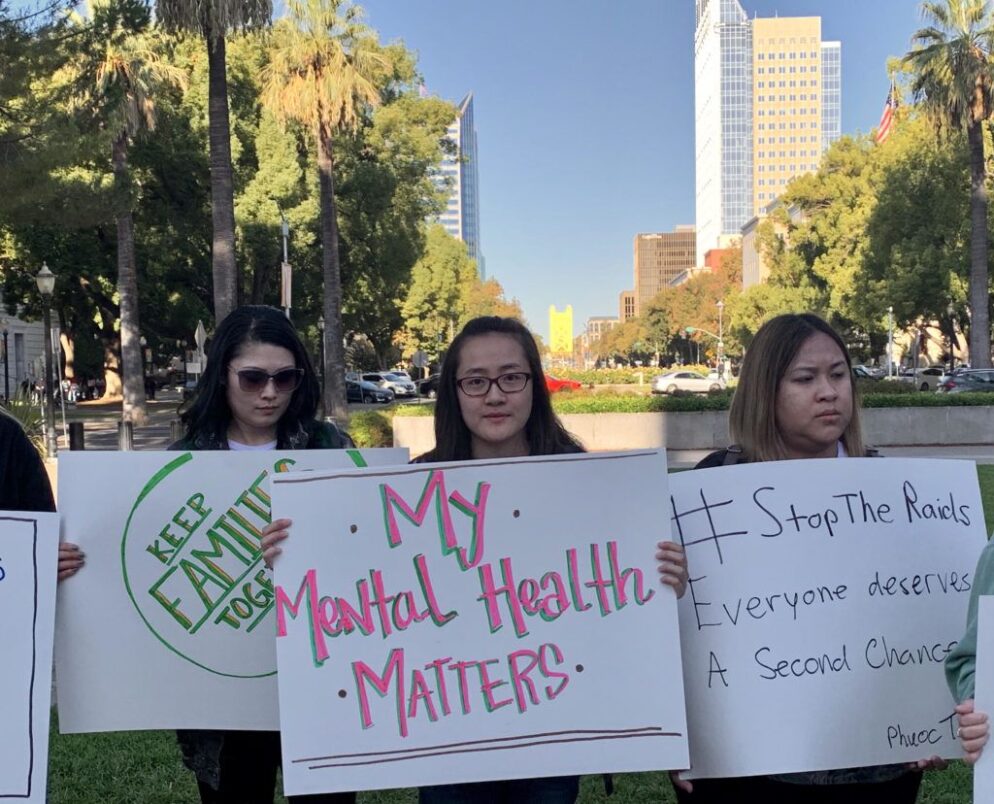 Advocates holding signs to support mental health