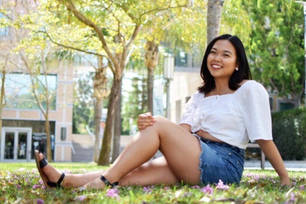 A woman smiling.