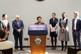 A person stands at a podium