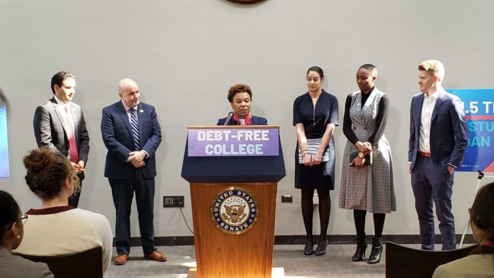 A person stands at a podium