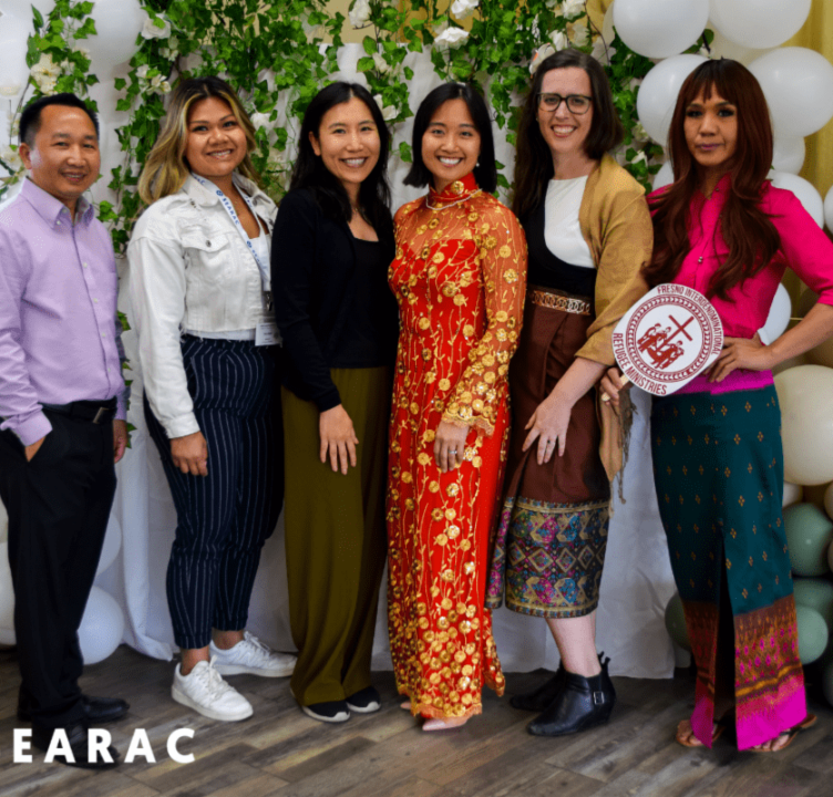 SEARAC and FIRM staffs standing in front of a backdrop.