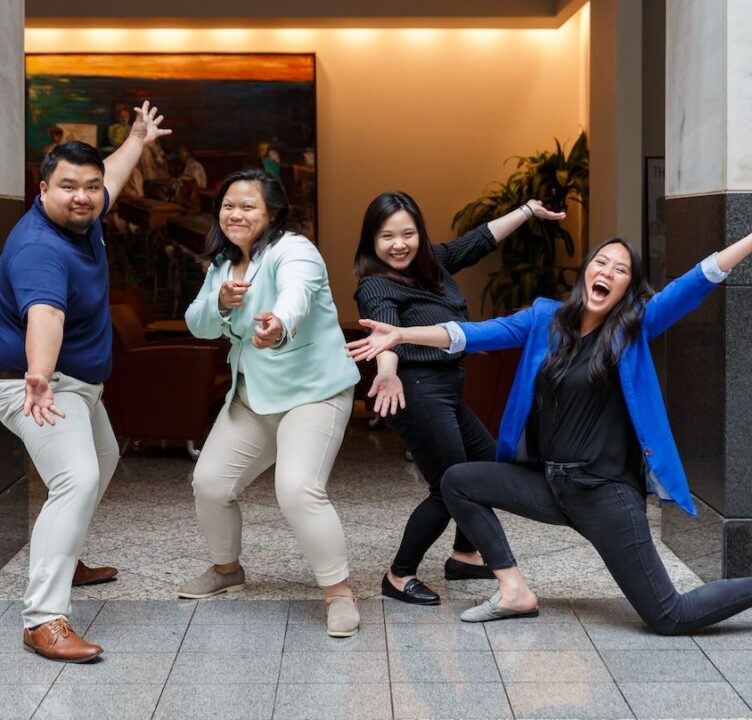 Four people strike silly poses