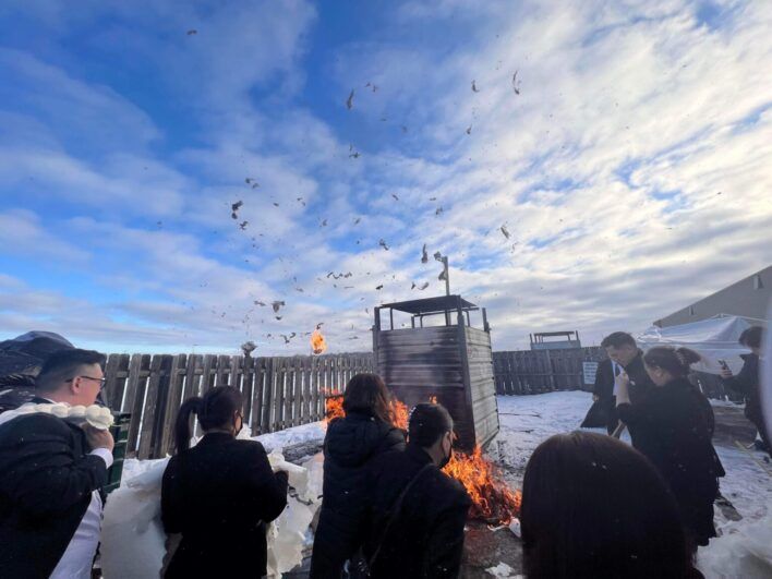 People gathered around a fire.