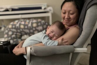 Quyen with her baby on her arms.