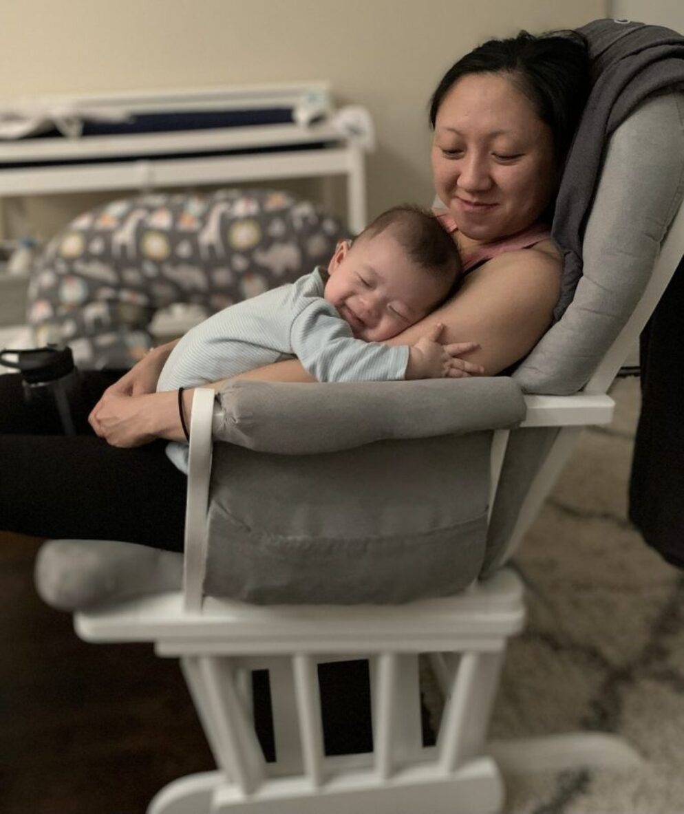 Quyen with her baby on her arms.