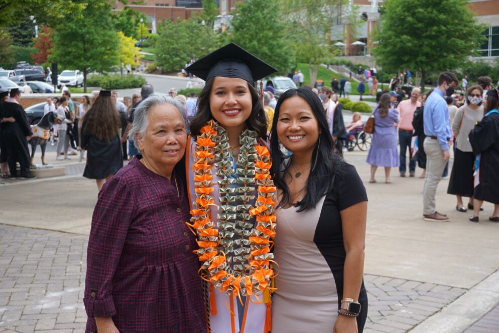 Jazmin celebrating graduation with her family.