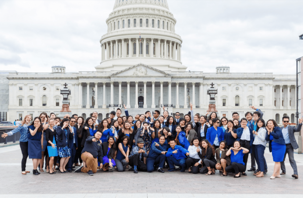 group poses in front of Capitol Building