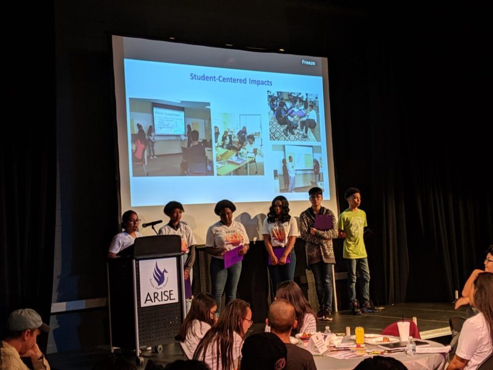 Youths giving a presentation.