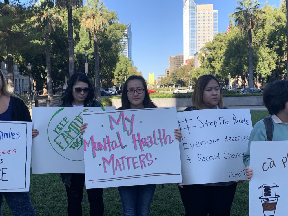 Person holds sign saying My Mental Health Matters