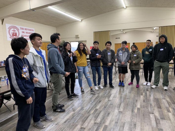 Youth standing in a circle together