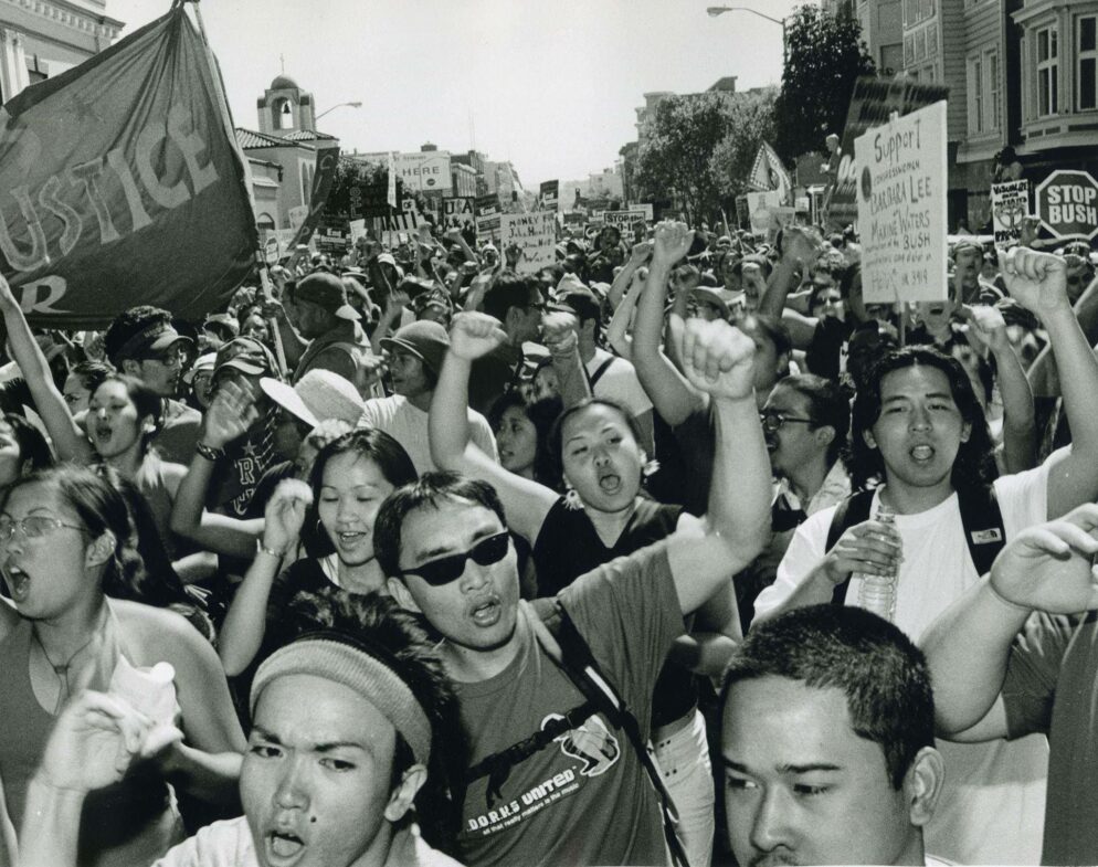 A black and white image of people protesting for social justice