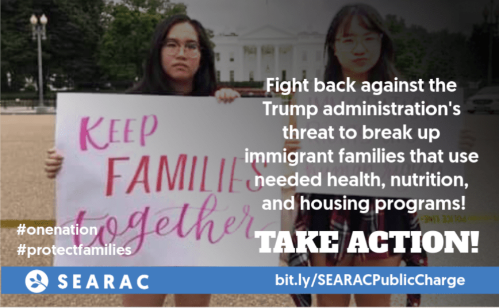 An image of two young people holding a sign that says Keep Families Together