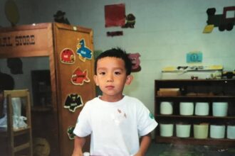 A child holding a doodle board