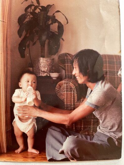 Quyen as a baby with her dad.