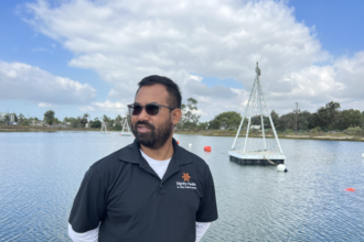 An image of a man looking out from the lagoon