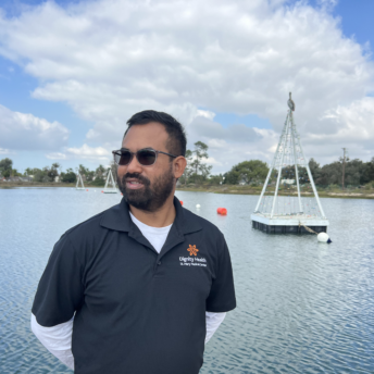 An image of a man looking out from the lagoon