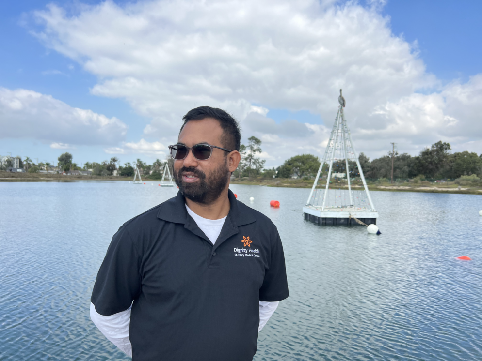 An image of a man looking out from the lagoon