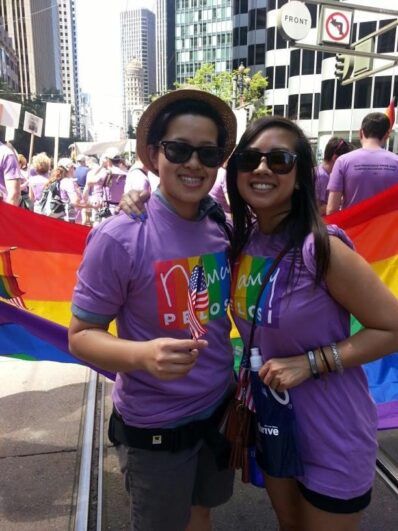 Two people at a pride parade.