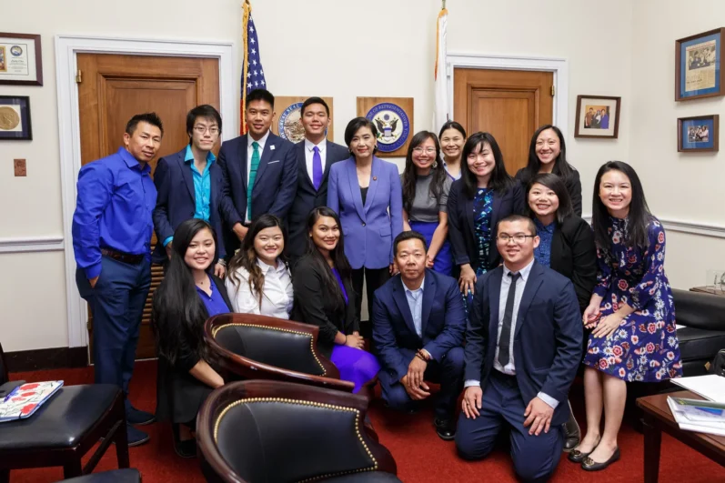 group of individuals pose in an office